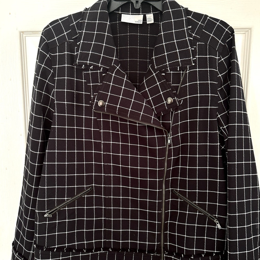 Women’s black and white side zip jacket. Waist length